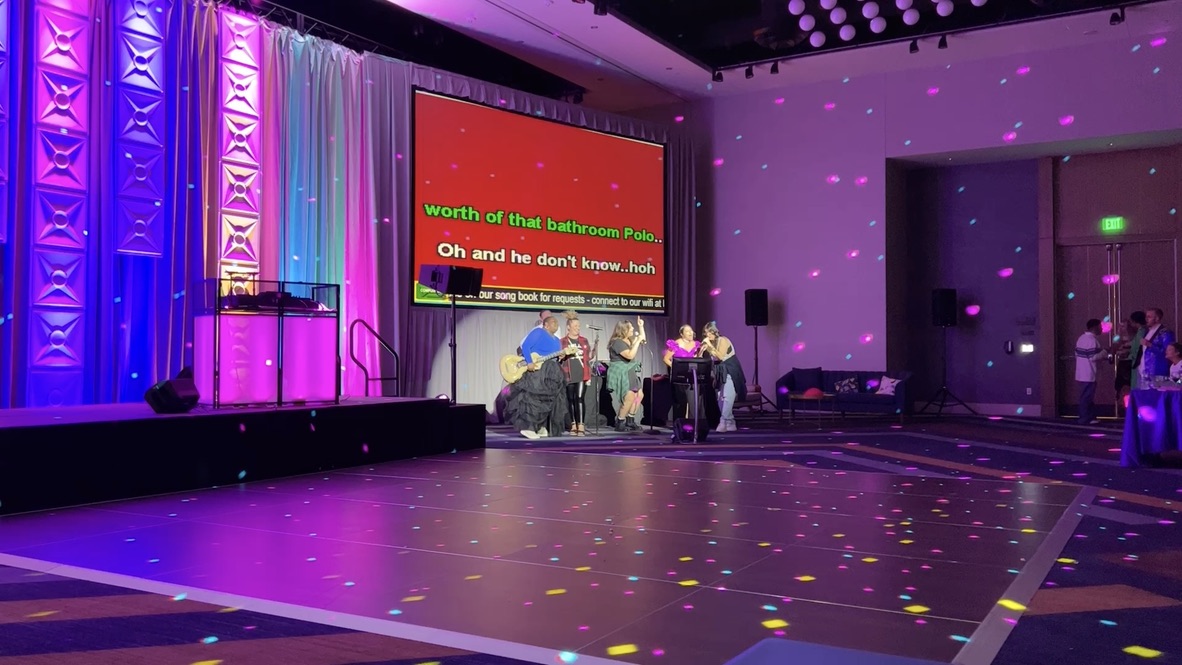 Recent karaoke event with full crowd and bright stage